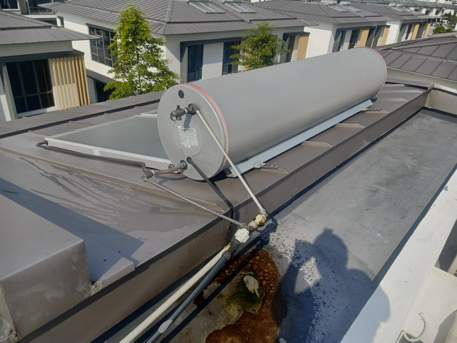 Ponding water and staining around a drain outlet on an Eco Ardence flat roof.