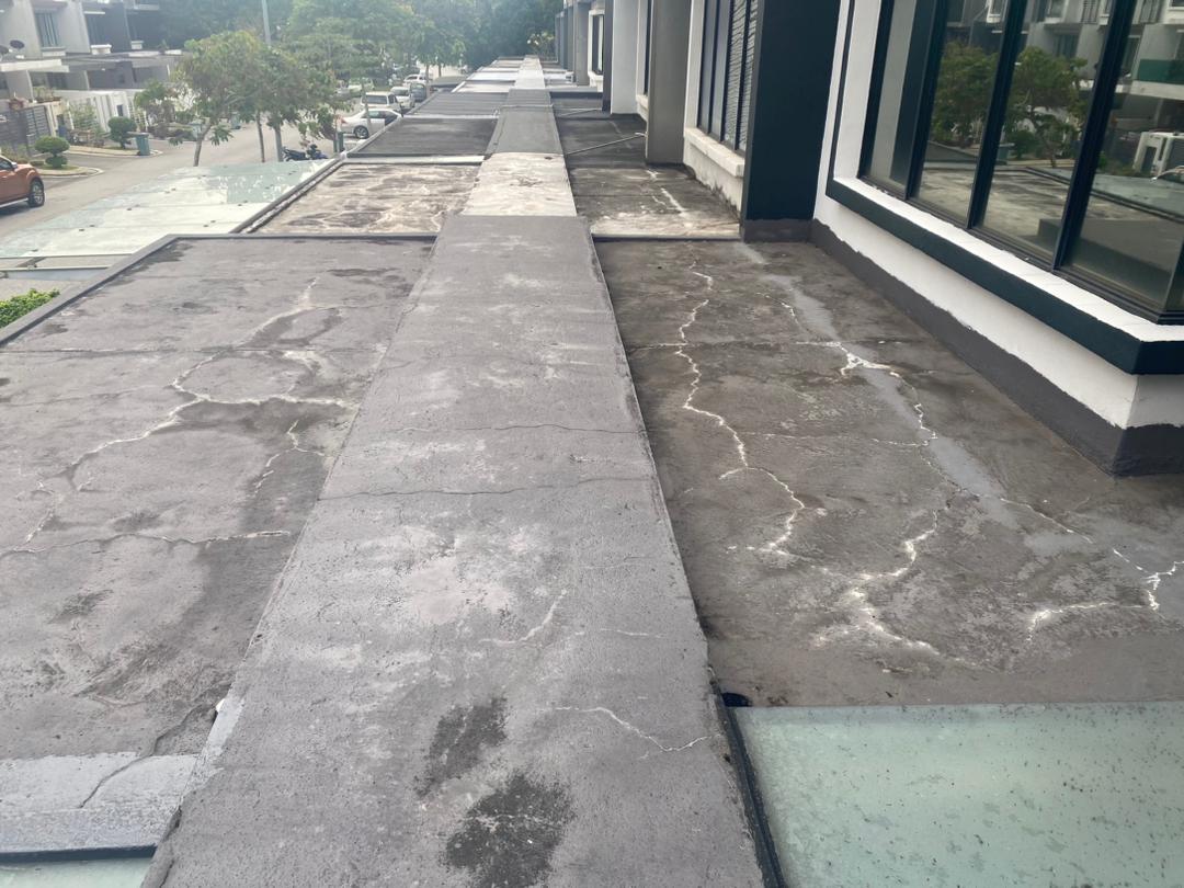 White salt-deposit efflorescence patterns across a Sungai Besi concrete roof.